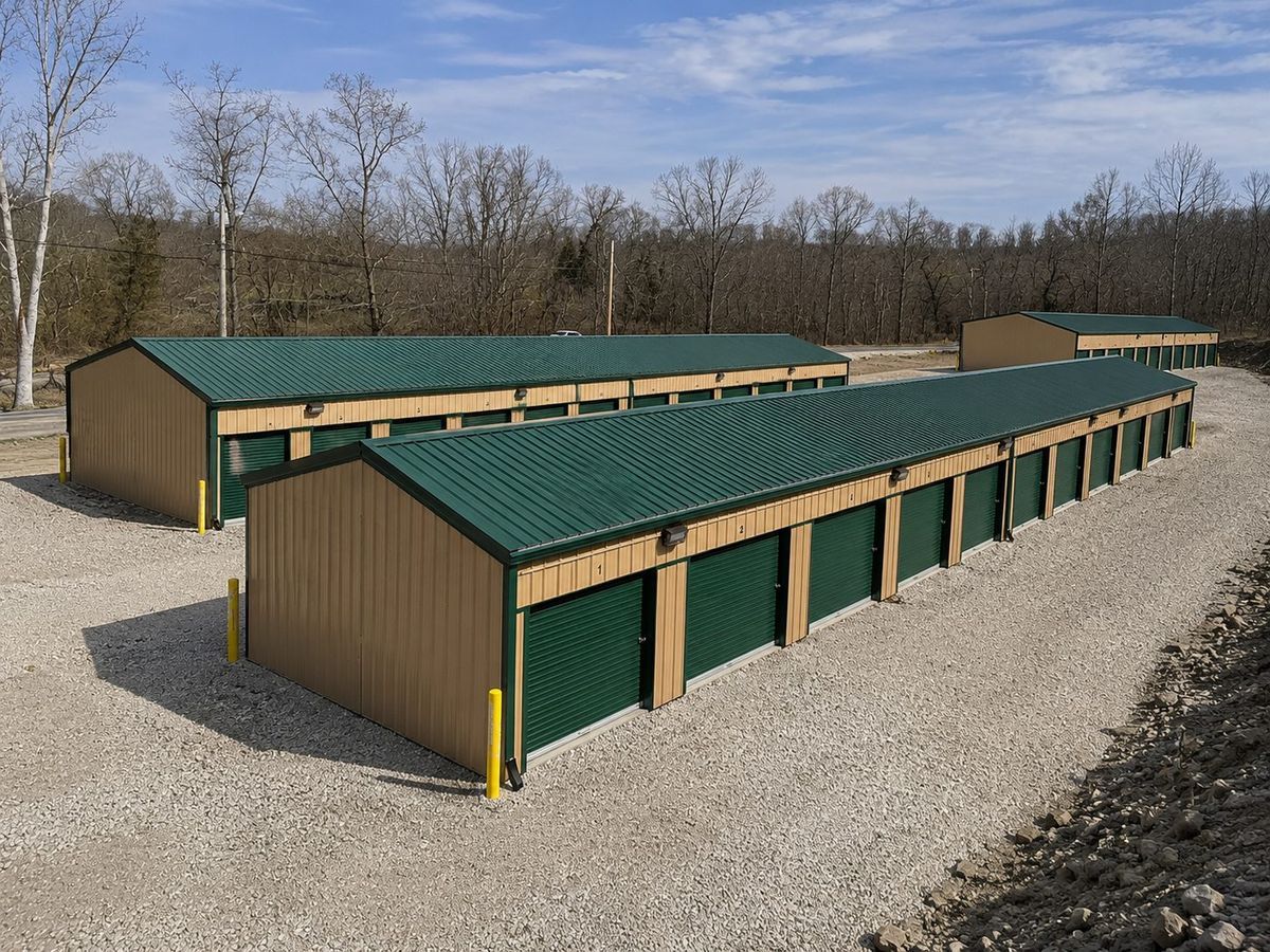 Aerial view of U.S. 60 West Storage LLC showing multiple rows of storage units with green doors and tan metal siding in Ashland, KY